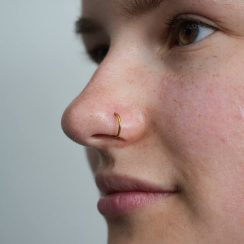 Close up of a fresh nostril piercing