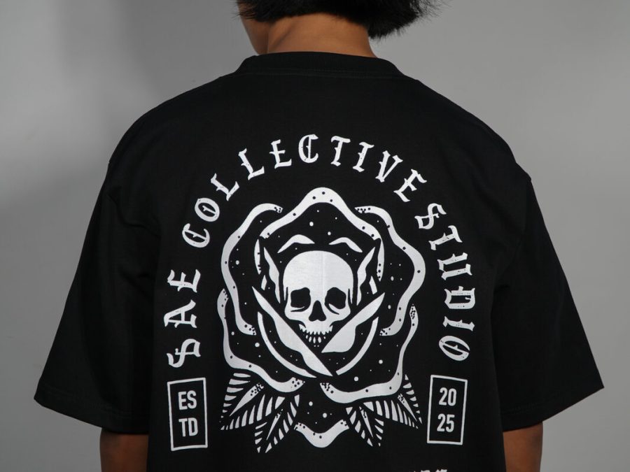 SAE Collective Studio t-shirt with a skull and rose crest reading Ink With Attitude